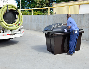 employee picking up near his truck